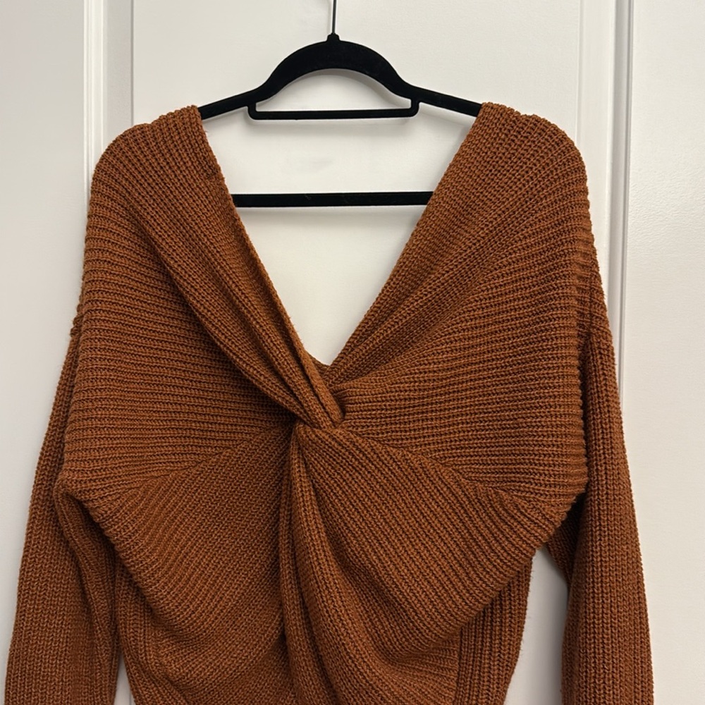 orange brown sweater with long sleeves